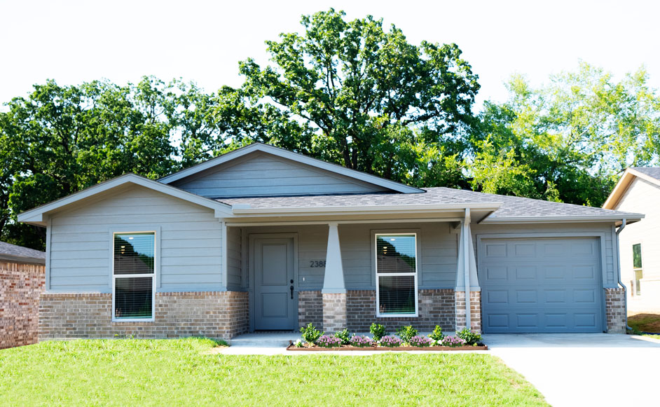 The Dales Elevation in the 1200 Series by Wyldewood Homes located only on Miller Street in Denison, texas